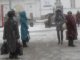 Фото: Сьогодні полтавці ховалися від снігу під парасольками