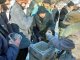 Фото: На площі перед Південним вокзалом Полтави віряни щодня годують безхатченків